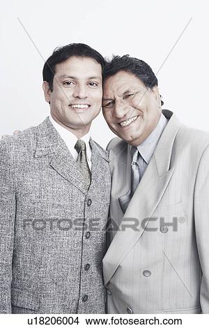 Portrait of a father and his son smiling View Large Photo Image Picture - Portrait of a father and his son smiling. Fotosearch