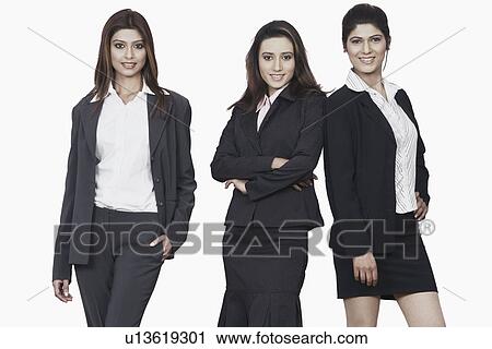 Stock Image - Portrait of three businesswomen smiling. Fotosearch