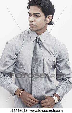 Close-up of a businessman looking sideways View Large Photo Image Stock Photo - Close-up of a businessman looking sideways. Fotosearch