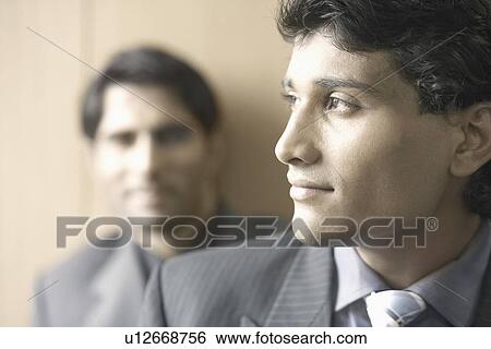 Stock Photograph - Close-up of a businessman looking sideways. Fotosearch