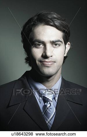 Stock Photo - Portrait of a businessman grinning. Fotosearch