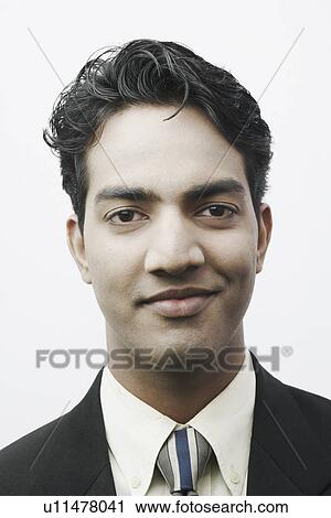 Portrait of a businessman smiling View Large Photo Image Stock Image - Portrait of a businessman smiling. Fotosearch