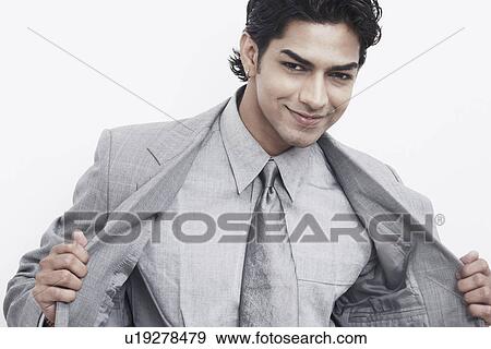 Portrait of a businessman smiling View Large Photo Image Stock Photo - Portrait of a businessman smiling. Fotosearch