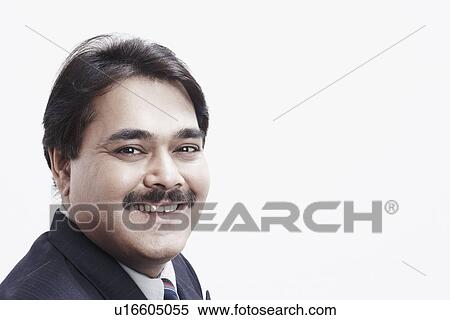 Stock Photography - Portrait of a businessman smiling. Fotosearch