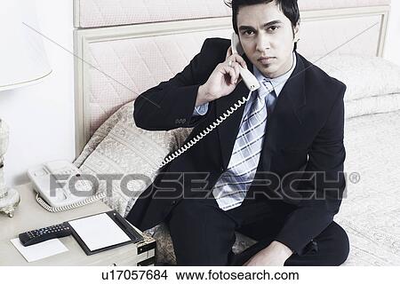 Portrait of a businessman talking on the telephone View Large Photo Image Picture - Portrait of a businessman talking on the telephone. Fotosearch