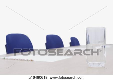 Close-up of a glass of water on a conference table View Large Photo Image Stock Photo - Close-up of a glass of water on a conference table. Fotosearch
