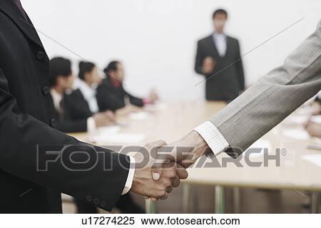 Close-up of two businessmen shaking hands View Large Photo Image Stock Photography - Close-up of two businessmen shaking hands. Fotosearch
