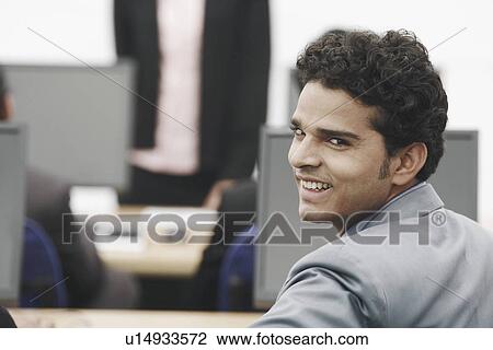 Stock Image - Portrait of a businessman smiling. Fotosearch