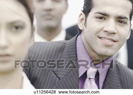 Stock Photo - Portrait of a businessman smiling. Fotosearch