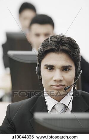 Portrait of a businessman wearing a headset View Large Photo Image Stock Photography - Portrait of a businessman wearing a headset. Fotosearch