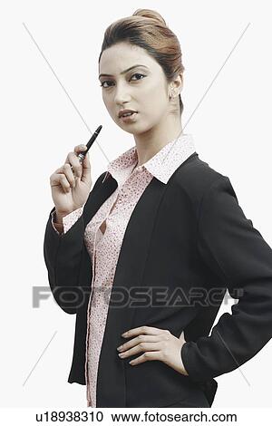 Stock Image - Portrait of a businesswoman holding a pen. Fotosearch