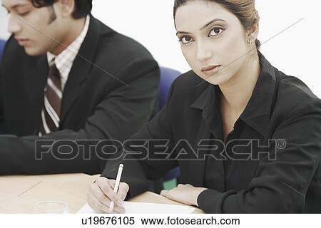 Portrait of a businesswoman sitting in a conference room View Large Photo Image Stock Photography - Portrait of a businesswoman sitting in a conference room. Fotosearch