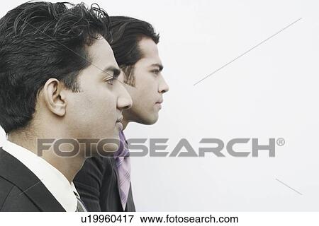 Stock Photo - Side profile of two businessmen. Fotosearch