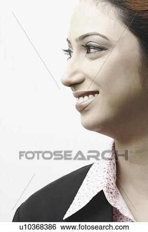 Close-up of a businesswoman smiling View Large Photo Image Stock Photograph - Close-up of a businesswoman smiling. Fotosearch