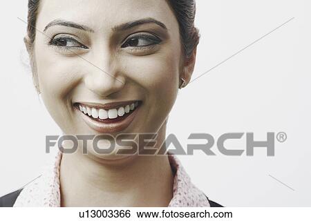 Stock Photograph - Close-up of a businesswoman smiling. Fotosearch