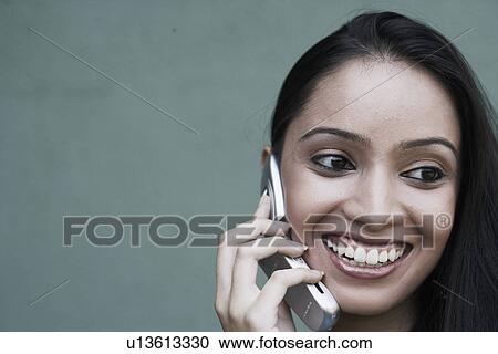 Close-up of a teenage girl talking on a mobile phone View Large Photo Image Stock Image - Close-up of a teenage girl talking on a mobile phone. Fotosearch