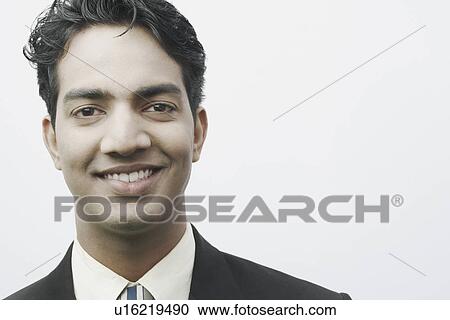 Portrait of a businessman smiling View Large Photo Image Stock Image - Portrait of a businessman smiling. Fotosearch