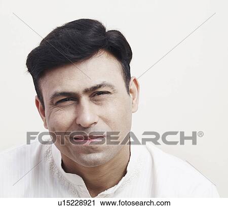Portrait of a mid adult man smirking View Large Photo Image Stock Image - Portrait of a mid adult man smirking. Fotosearch