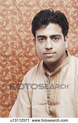 Portrait of a young man looking serious View Large Photo Image Stock Image - Portrait of a young man looking serious. Fotosearch