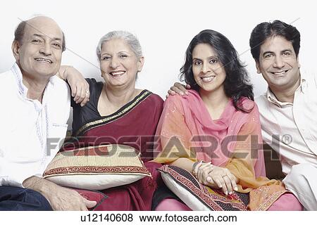 Stock Photo - Portrait of four people smiling. Fotosearch