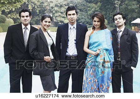 Picture - Portrait of two young women with three young men. Fotosearch