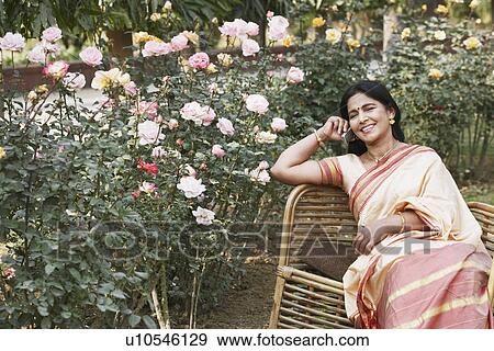 Portrait of a mature woman talking on a mobile phone View Large Photo Image Stock Photo - Portrait of a mature woman talking on a mobile phone. Fotosearch