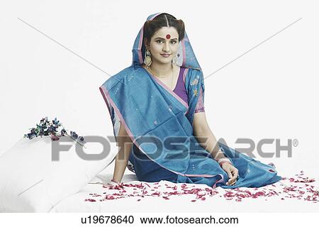 Portrait of a young woman sitting View Large Photo Image Stock Image - Portrait of a young woman sitting. Fotosearch