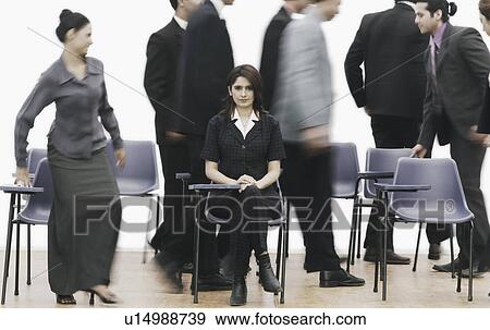 Portrait of a businesswoman sitting on a chair View Large Photo Image Stock Photo - Portrait of a businesswoman sitting on a chair. Fotosearch