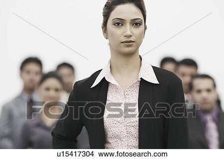 Portrait of a businesswoman standing in an office View Large Photo Image Picture - Portrait of a businesswoman standing in an office. Fotosearch