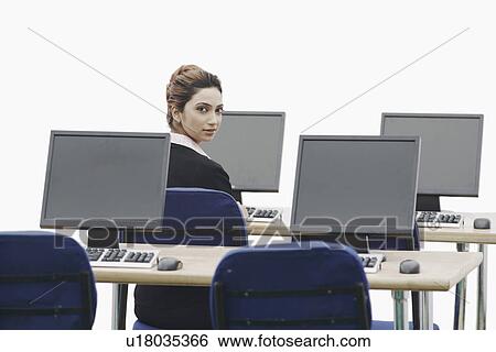 Stock Photograph - Portrait of a businesswoman working on a computer. Fotosearch
