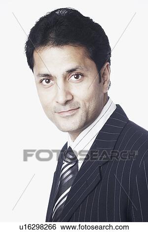 Stock Photograph - Side profile of a businessman grinning. Fotosearch