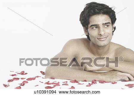 Close-up of a young man leaning against a massage table View Large Photo Image Picture - Close-up of a young man leaning against a massage table. Fotosearch