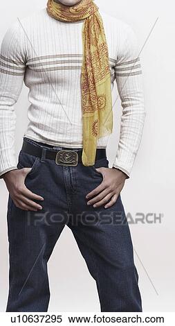 Mid section view of a man standing with his hands in his pockets View Large Photo Image Stock Photography - Mid section view of a man standing with his hands in his pockets. Fotosearch