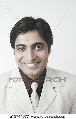 Stock Photo - Portrait of a businessman smiling. Fotosearch