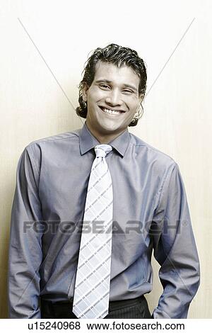 Portrait of a businessman smiling View Large Photo Image Stock Photo - Portrait of a businessman smiling. Fotosearch