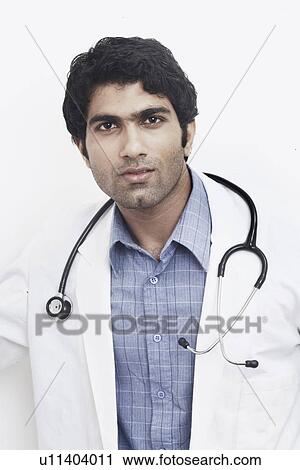 Stock Image - Portrait of a male doctor with a stethoscope around his neck. Fotosearch