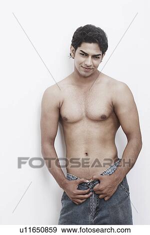 Stock Photo - Portrait of a young man posing. Fotosearch