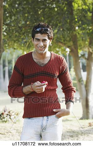Stock Image - Portrait of a young man smiling. Fotosearch