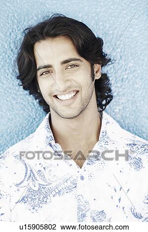 Stock Image - Portrait of a young man smiling. Fotosearch