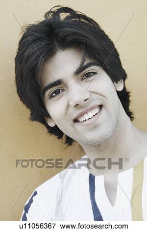 Stock Photo - Portrait of a young man smiling. Fotosearch