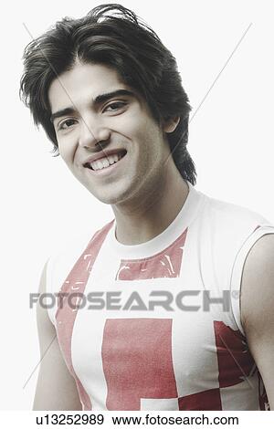 Portrait of a young man smiling View Large Photo Image Stock Photo - Portrait of a young man smiling. Fotosearch