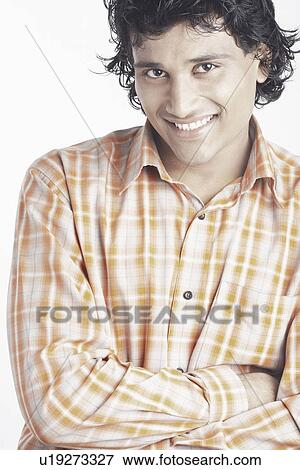 Portrait of a young man smiling View Large Photo Image Stock Photo - Portrait of a young man smiling. Fotosearch