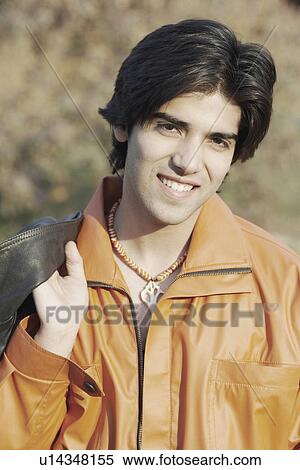 Portrait of a young man smiling View Large Photo Image Stock Photography - Portrait of a young man smiling. Fotosearch