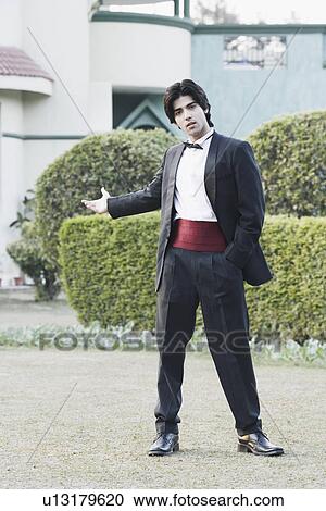 Stock Image - Portrait of a young man standing. Fotosearch