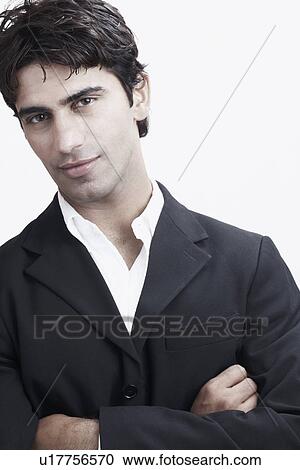 Portrait of a young man with his arms crossed View Large Photo Image Stock Image - Portrait of a young man with his arms crossed. Fotosearch