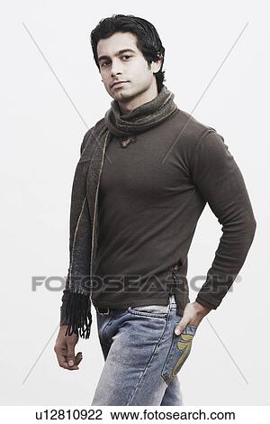 Portrait of a young man with his hand in his pocket View Large Photo Image Stock Image - Portrait of a young man with his hand in his pocket. Fotosearch