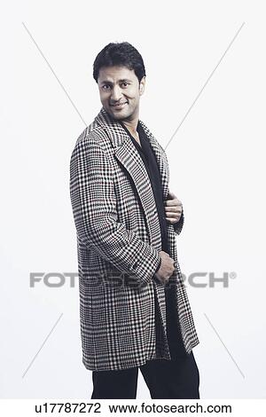 Side profile of a mid adult man smiling View Large Photo Image Stock Image - Side profile of a mid adult man smiling. Fotosearch