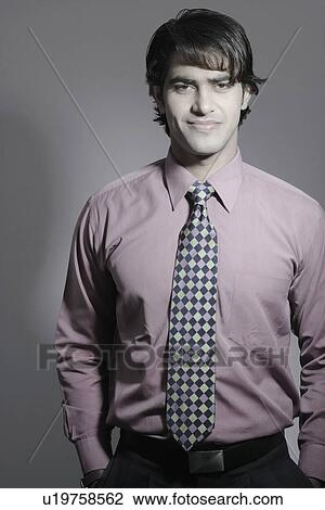 Portrait of a businessman smiling View Large Photo Image Stock Image - Portrait of a businessman smiling. Fotosearch