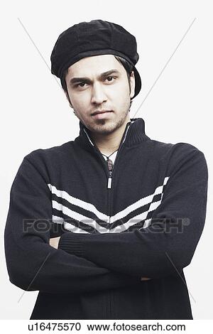 Portrait of a young man with his arms crossed View Large Photo Image Stock Image - Portrait of a young man with his arms crossed. Fotosearch