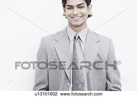 Portrait of a businessman smiling View Large Photo Image Stock Image - Portrait of a businessman smiling. Fotosearch